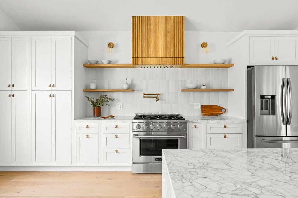 Kitchen renovation with clean cabinetry and quartz top